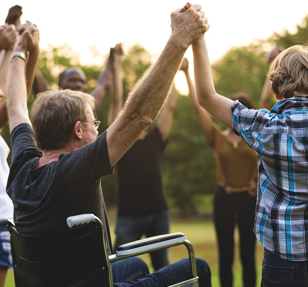 Man in wheelchair celebrating